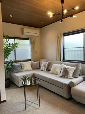 a living room with a couch and two windows at Best Shinjuku Modern Full-furnished Family size Apartment3 ONLY 2min to Shinjuku by Train in Tokyo