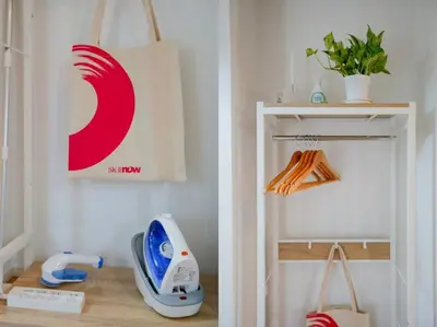 a room with a white shelf with a hair dryer at Skytree Cozy House in Tokyo