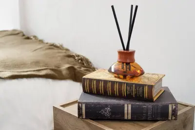 a stack of books and a vase on a table at CentralTokyo・Shinjuku/ 4BedRooms/8Beds / old style in Tokyo