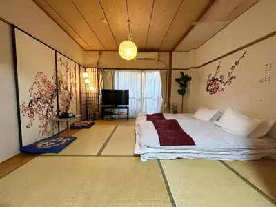 a bedroom with a bed and a television in it at Shinjuku Shin-Okubo Station Nippon no Yado in Tokyo