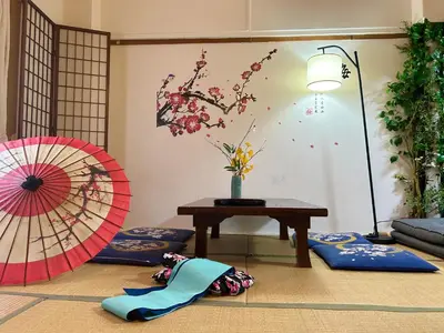 a room with a table and two umbrellas on the floor at Shinjuku Shin-Okubo Station Nippon no Yado in Tokyo