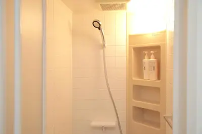 a shower with a shower head in a bathroom at \u30b2\u30b9\u30c8\u30cf\u30a6\u30b9\u6634 in Tokyo