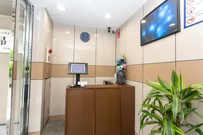 an office lobby with a tv on the wall at \u30b2\u30b9\u30c8\u30cf\u30a6\u30b9\u6634 in Tokyo