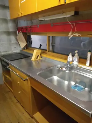 a kitchen with a stainless steel sink and a counter at Ikebukuro sta. 10mins walk. Rough style 88\u33a1 House in Tokyo