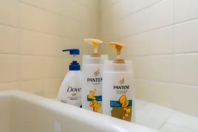 three bottles of cleaning products sitting on a bath tub at Budget 3-Bedrooms Villa#4mins to Ikebukuro#Hight speed wifi#Near Train Tracks in Tokyo