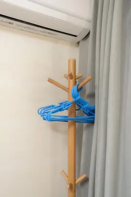 a wooden cross with a blue rope on a wall at Budget 3-Bedrooms Villa#4mins to Ikebukuro#Hight speed wifi#Near Train Tracks in Tokyo