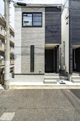 a building with two doors and stairs on a street at SKYTREE HOUSE in Tokyo