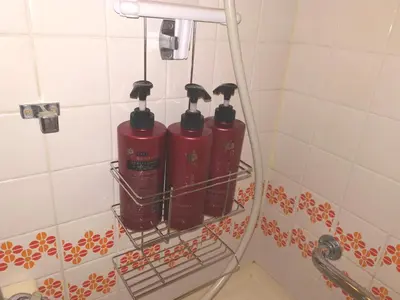 two red fire hydrants on a rack in a bathroom at B Shinjuku Self Check in in Tokyo
