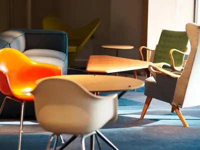 a group of chairs and tables in a room at WPÜ HOTEL Shinjuku in Tokyo
