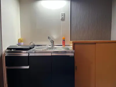 a kitchen with a sink and a sink at YOSHINO HOUSE!! Central Shinjuku Okubo Stay - Comfortable & Convenient in Tokyo