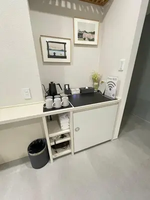 a kitchen counter with a sink in a room at Ueno Colon Hotel in Tokyo
