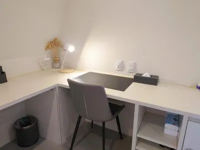 a white desk with a chair in a room at Ueno Colon Hotel in Tokyo