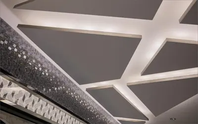 a coffered ceiling in a building with silver at HOTEL KABUKI in Tokyo