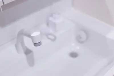 a close up of a bathroom with a sink at SATELLITE HOTEL Roppongi \u30b5\u30c6\u30e9\u30a4\u30c8\u30db\u30c6\u30eb\u516d\u672c\u6728 in Tokyo