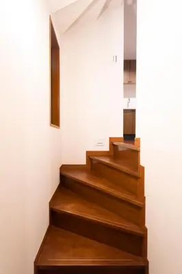 a staircase in a house with wooden floors at SATELLITE HOTEL Roppongi \u30b5\u30c6\u30e9\u30a4\u30c8\u30db\u30c6\u30eb\u516d\u672c\u6728 in Tokyo