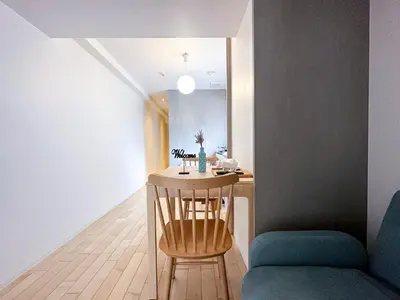 a small kitchen with a table and a chair at nestay apartment tokyo shinjuku in Tokyo