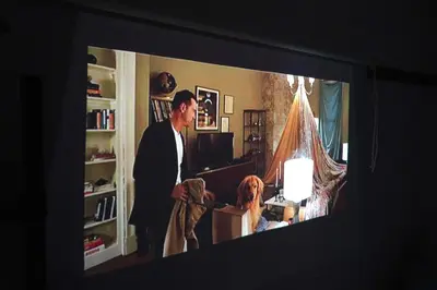 a man is standing in a living room with at Close to Shinjuku!Twin beds,Projector,Appliances! in Tokyo