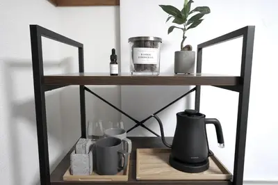 a shelf with a coffee maker and other items on it at Close to Shinjuku!Twin beds,Projector,Appliances! in Tokyo