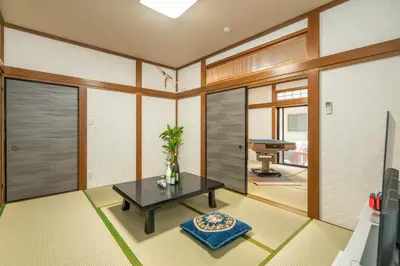 a living room with a table and a pool table at JR 66sqm 1F Family Suite 2LDK JR Koiwa-Keisei Koiwa-Asakusa-Oshiage-Shinjuku-Ueno in Tokyo