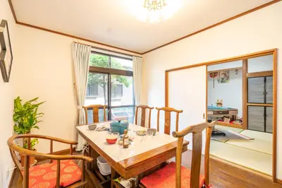 a dining room with a table and chairs at JR 66sqm 1F Family Suite 2LDK JR Koiwa-Keisei Koiwa-Asakusa-Oshiage-Shinjuku-Ueno in Tokyo