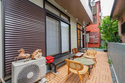 a patio with a heater and a table and chairs at JR 66sqm 1F Family Suite 2LDK JR Koiwa-Keisei Koiwa-Asakusa-Oshiage-Shinjuku-Ueno in Tokyo