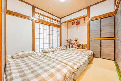a bedroom with a large bed in a room at JR 66sqm 1F Family Suite 2LDK JR Koiwa-Keisei Koiwa-Asakusa-Oshiage-Shinjuku-Ueno in Tokyo