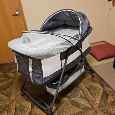 a baby stroller sitting on top of a floor at ueno minowa401 in Tokyo
