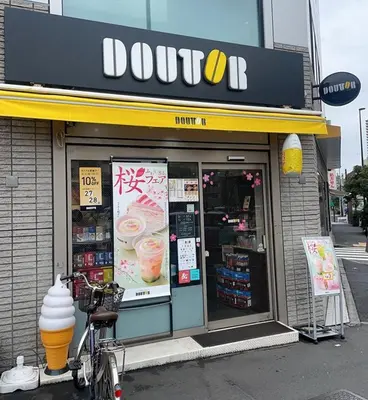 a donut shop with a bike parked outside of it at ueno minowa401 in Tokyo
