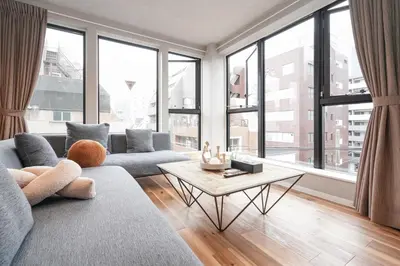 a living room with a couch and a table at Tokyo IKOI HOTEL\u30fc\u7dba\u9e97\u306a\u30db\u30c6\u30eb in Tokyo
