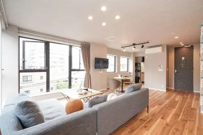 a living room with a couch and a table at Tokyo IKOI HOTEL\u30fc\u7dba\u9e97\u306a\u30db\u30c6\u30eb in Tokyo