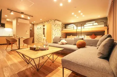 a living room with a couch and a table at Tokyo IKOI HOTEL\u30fc\u7dba\u9e97\u306a\u30db\u30c6\u30eb in Tokyo