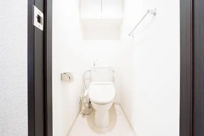 a bathroom with a white toilet in a stall at Square Shibuya in Tokyo