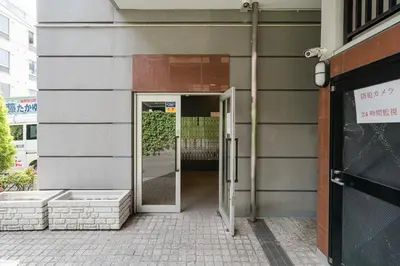 an entrance to a building with a glass door at Square Shibuya in Tokyo