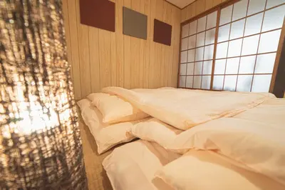 a row of beds in a room with a window at Sumida-ku - House - Vacation STAY 14512 in Tokyo