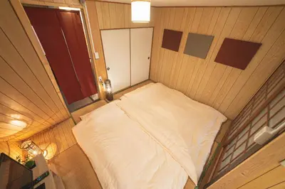 a small room with a bed in a wooden wall at Sumida-ku - House - Vacation STAY 14512 in Tokyo