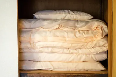 a closet with a bed with white sheets at Sumida-ku - House - Vacation STAY 14512 in Tokyo