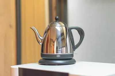 a black tea kettle sitting on top of a table at Sumida-ku - House - Vacation STAY 14512 in Tokyo