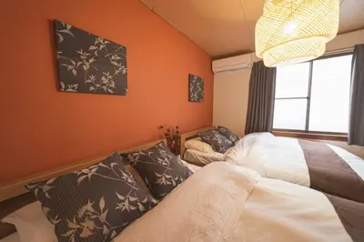 a bedroom with two beds and a window at Sumida-ku - House - Vacation STAY 14512 in Tokyo
