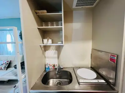 a small kitchen with a sink and a toilet at OkuboZYZ SJ0244 in Tokyo