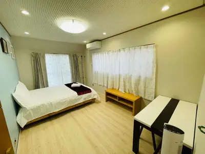 a small room with a bed and a window at Nishi-Shinjuku 3LDK SJ0243 in Tokyo