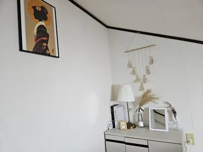 a room with a desk with a picture on the wall at Shibuya SG House Free Wifi in Tokyo
