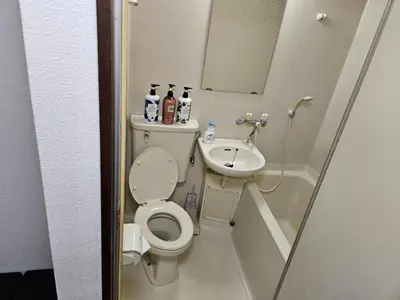 a small bathroom with a toilet and a sink at Shibuya SG House Free Wifi in Tokyo