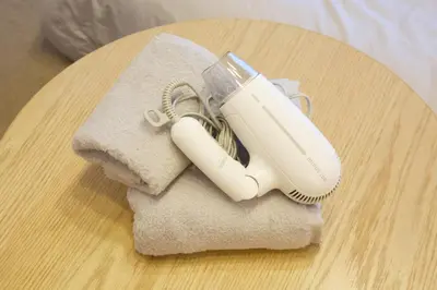 a hair dryer sitting on top of a table at SQUARE SHIBUAYA 403 in Tokyo