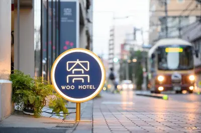 aoga hotel sign on the side of a city street at Ueno Woo Hotel in Tokyo