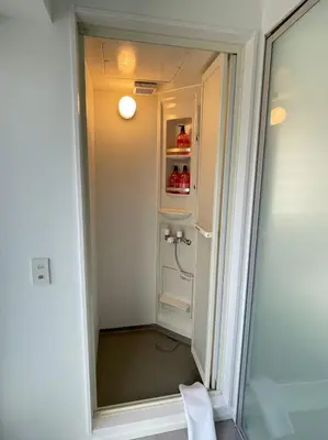 a shower in a bathroom with a glass door at Hotel Apreton in Tokyo