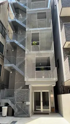a building with stairs on the side of it at Hotel Apreton in Tokyo
