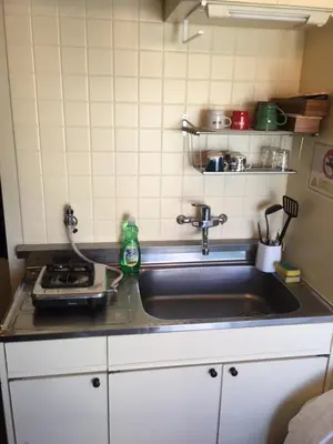 a kitchen counter with a sink and a stove at 10 minutes direct to Shibuya Crossing! Heart of Tokyo! Mishuku in Tokyo